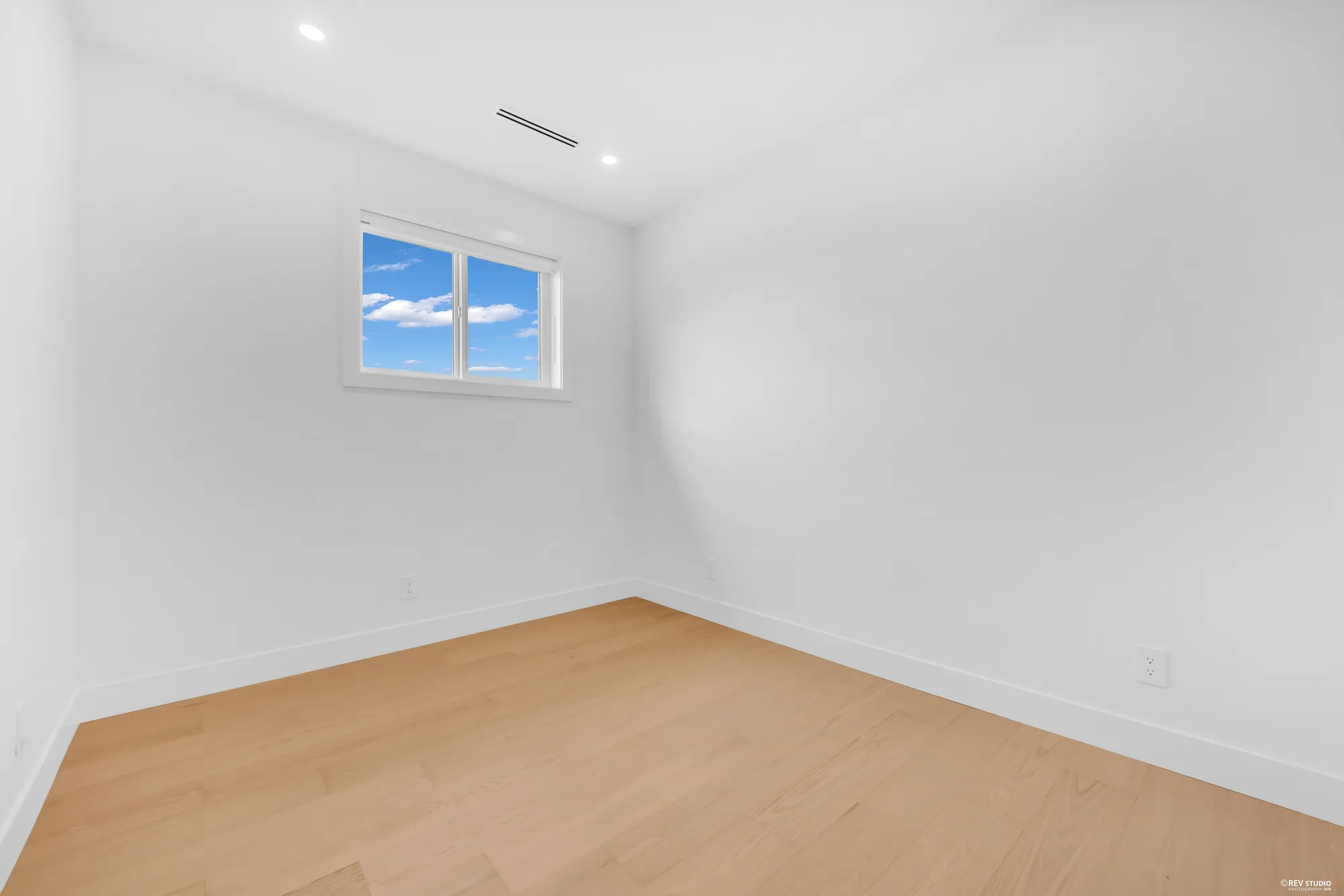 Second bedroom with a window over the roofline